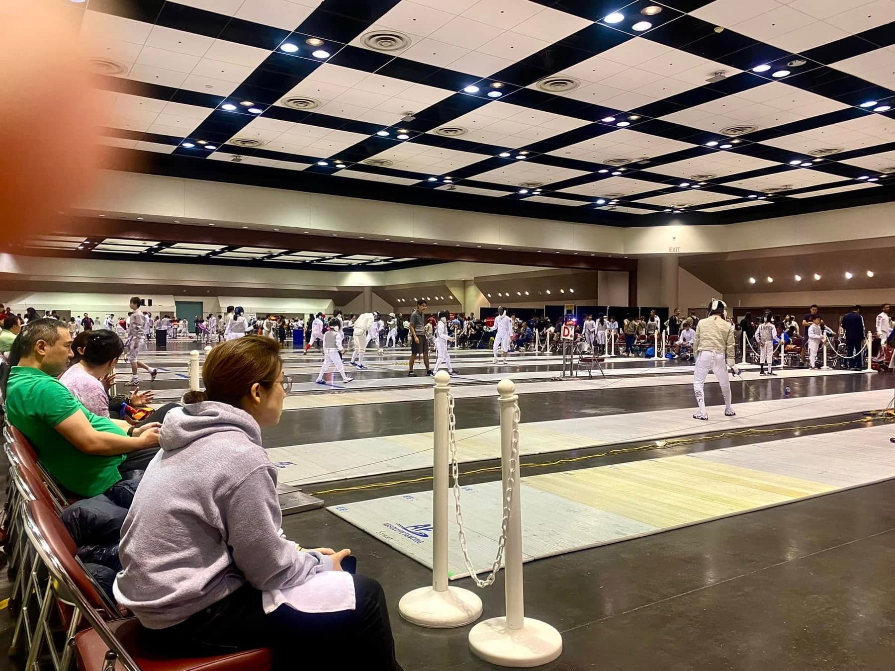 Marin Fencing Academy — The hall at a national tournament, strips running the length of the floor